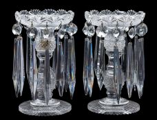 A pair of cut-glass table lustres with knopped and faceted stems,