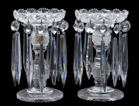 A pair of cut-glass table lustres with knopped and faceted stems,