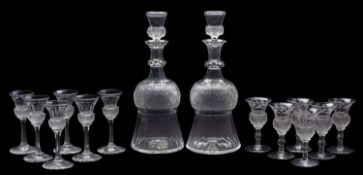 WITHDRAWN Two thistle shaped decanters and stoppers and two sets of six tot glasses,