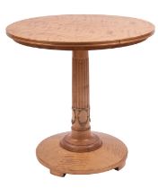 A Continental, probably Baltic satin birch occasional table in Empire taste,