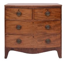 A late George III mahogany bowfront chest of drawers, circa 1800; the top with reeded edges,