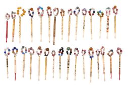 A collection of Victorian turned and partly painted lace bobbins,