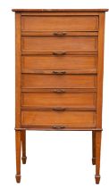 An Edwardian satin maple filing chest, early 20th century; with banded top,