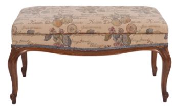 A carved walnut and upholstered duet stool in 18th century taste; early 20th century;