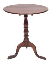 A George III oak and mahogany tripod table,