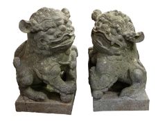 A pair of carved shist lion dogs, probably Indonesian,