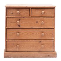 A pine chest of drawers in 19th century style, 20th century; the top with moulded edges,