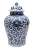 A Chinese blue and white chrysanthemum jar and cover, Qing Dynasty with bud finial,