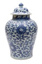 A Chinese blue and white chrysanthemum jar and cover, Qing Dynasty with bud finial,