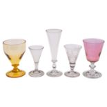 A mixed group of drinking glasses, comprising an ale mug engraved with hops and barley,