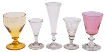 A mixed group of drinking glasses, comprising an ale mug engraved with hops and barley,
