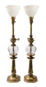 A pair of gilt metal and glass table lamps,