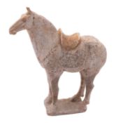 A Chinese painted pottery horse in Tang style standing four-square on plain rectangular base,
