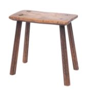An elm and oak stool, first half 19th century; with rectangular seat and four splayed,