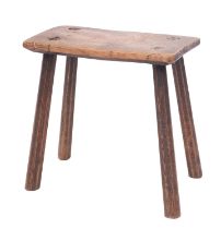 An elm and oak stool, first half 19th century; with rectangular seat and four splayed,