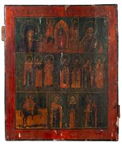 A Russian painted wood icon, 19th century; depicting scenes from the lives of Saints,