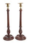 A pair of mahogany and brass mounted candlesticks in George III style,