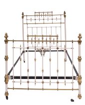 An Edwardian brass mounted metal bed, in Aesthetic Movement style,