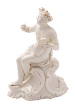 An 18th century Continental white classical figure in the form of Bacchus holding a cup and ewer,