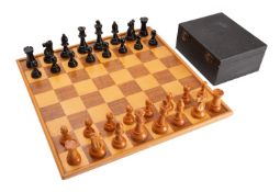 A boxwood and ebonised Staunton pattern chess set, mid 20th century; the kings 8.
