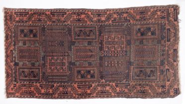 A Balouchistan rug, the serrated oblong panelled field with geometric designs,