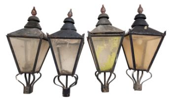 A set of four black-painted copper and acrylic lanterns,