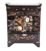 A Japanese inlaid and decorated black lacquer table cabinet with hinged top,