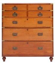 An Irish Victorian teak and brass bound campaign chest of drawers,
