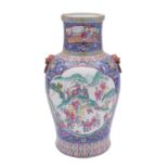 A Chinese famille rose vase with lion dog ring handles,