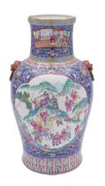 A Chinese famille rose vase with lion dog ring handles,