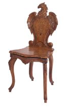 A 'Black Forest' carved walnut and marquetry musical side chair,