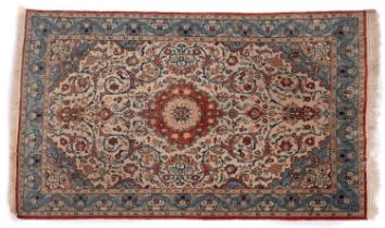 An Ispahan rug, the ivory cartouche field with central rust cartouche pole medallion,