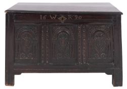 A William & Mary oak coffer, basically late 17th century; the hinged cover with moulded edges,