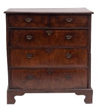 A George I walnut and pine chest of drawers,