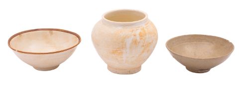 Two Chinese cream and celadon glazed bowls and a similar globular jar one bowl with painted mark