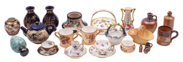 A mixed group of pottery and porcelain miniatures including a duck egg scent bottle,