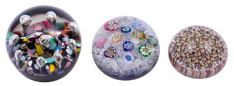 A Caithness Harlequin paperweight and two others, the former probably by Paul Ysart,