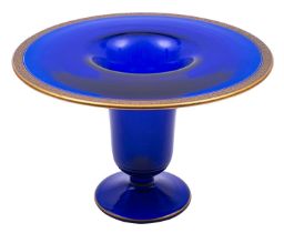 A blue glass footed vase with flaring rim and acid etched floral decorated gold rim, 27cm diameter.