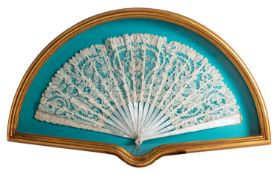 A mother of pearl and lacework articulated fan,