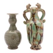 A Chinese provincial dragon-handled vase and a celadon glazed bottle the first incised with two