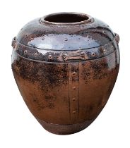 A large food storage jar, probably Vietnamese,