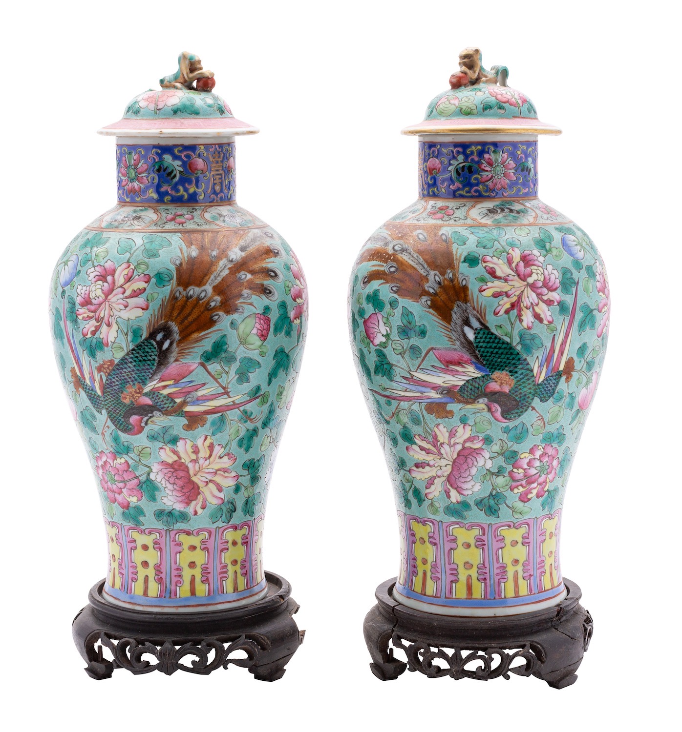 A pair of Chinese Straits baluster vases and covers, Qing Dynasty with lion dog finials,