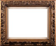 A giltwood picture frame with carved scroll decoration 58 x 47.