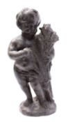 A lead model of a putto, probably emblematic of Autumn, 19th century; portrayed as nude,