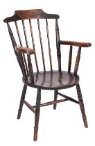 An elm and beech elbow chair in the style of a Windsor chair,