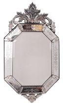 An etched and cut glass wall mirror in Venetian style,