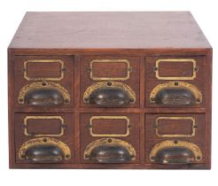An Edwardian oak counter-top filing box,