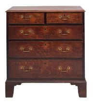 A George III oak chest of drawers, late 18th century; the top with ogee moulded edges,