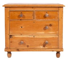 A pine chest of drawers,