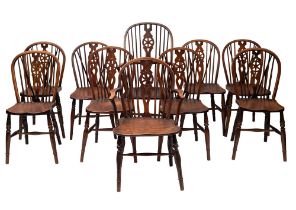 An associated set of ten elm, ash and beech wheelback chairs,